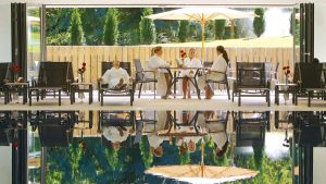 Relaxing on sun loungers by the pool with Champagne and friends - Donnington Valley Hotel, Golf & Spa, Newbury