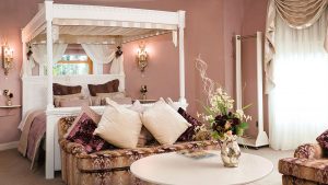 Four poster bed in a Deluxe double room- Hatherley Manor Hotel & Spa, Cotswolds