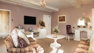 Plush seating in a Deluxe double room- Hatherley Manor Hotel & Spa, Cotswolds