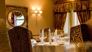The Dewinton restaurant set for dinner - Hatherley Manor Hotel & Spa, Cotswolds