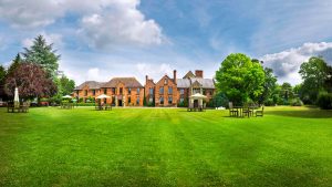 Long sweeping lawns and outdoor seating - Hatherley Manor Hotel & Spa, Cotswolds