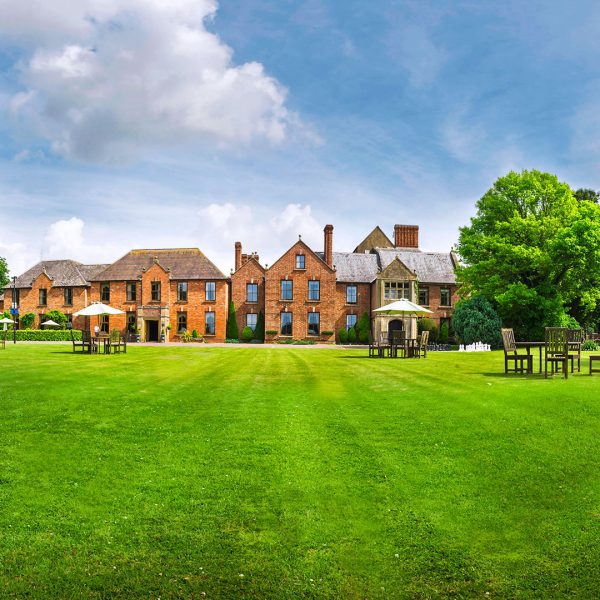 Long sweeping lawns and outdoor seating - Hatherley Manor Hotel & Spa, Cotswolds
