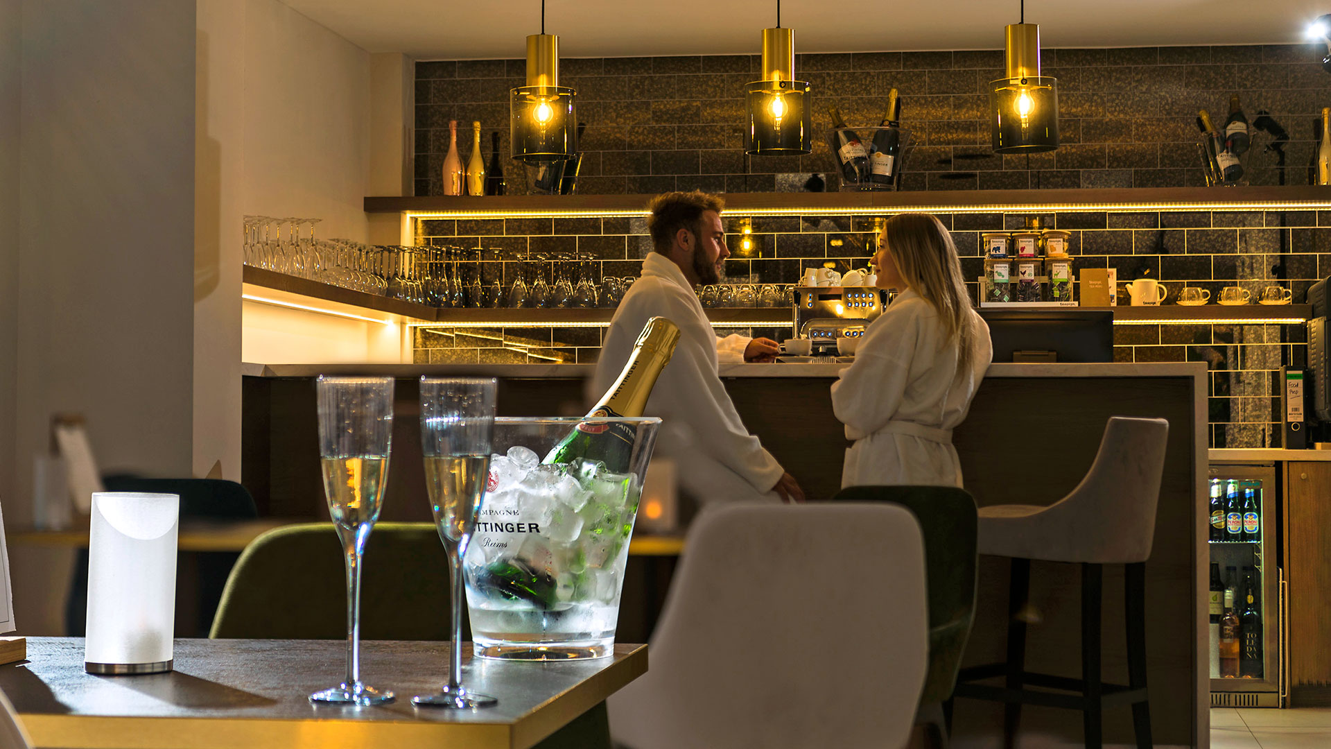 A chilled bottle of Champagne with two flutes for a relaxing couple in the Spa Cafe - Hatherley Manor Hotel & Spa, Cotswolds