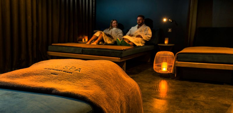 A couple relaxing in the Relaxtaion room - Hatherley Manor Hotel & Spa, Cotswolds