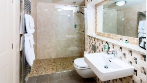 The bathroom in the Cedar Suite - Park Farm Hotel, Norwich