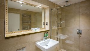 The bathroom in an Executive Suite - Park Farm Hotel, Norwich