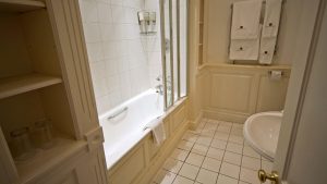 Bathroom in a standard room - Rowton Hall Hotel & Spa, Chester