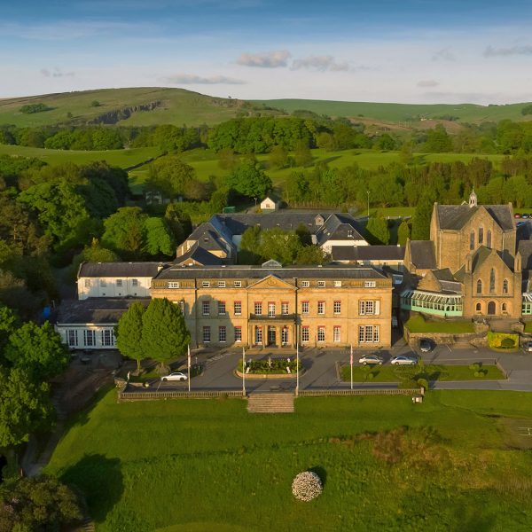 Aerial view of the hotel surrounded by lush greenery - Shrigley Hall Hotel & Spa