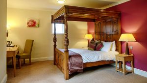 Four poster bed in a Luxury Double Room - Barns Hotel, Bedford