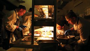 The team of chefs preparing gourmet dishes for the White Hart Restaurant - Dartington Hall Hotel, South Devon