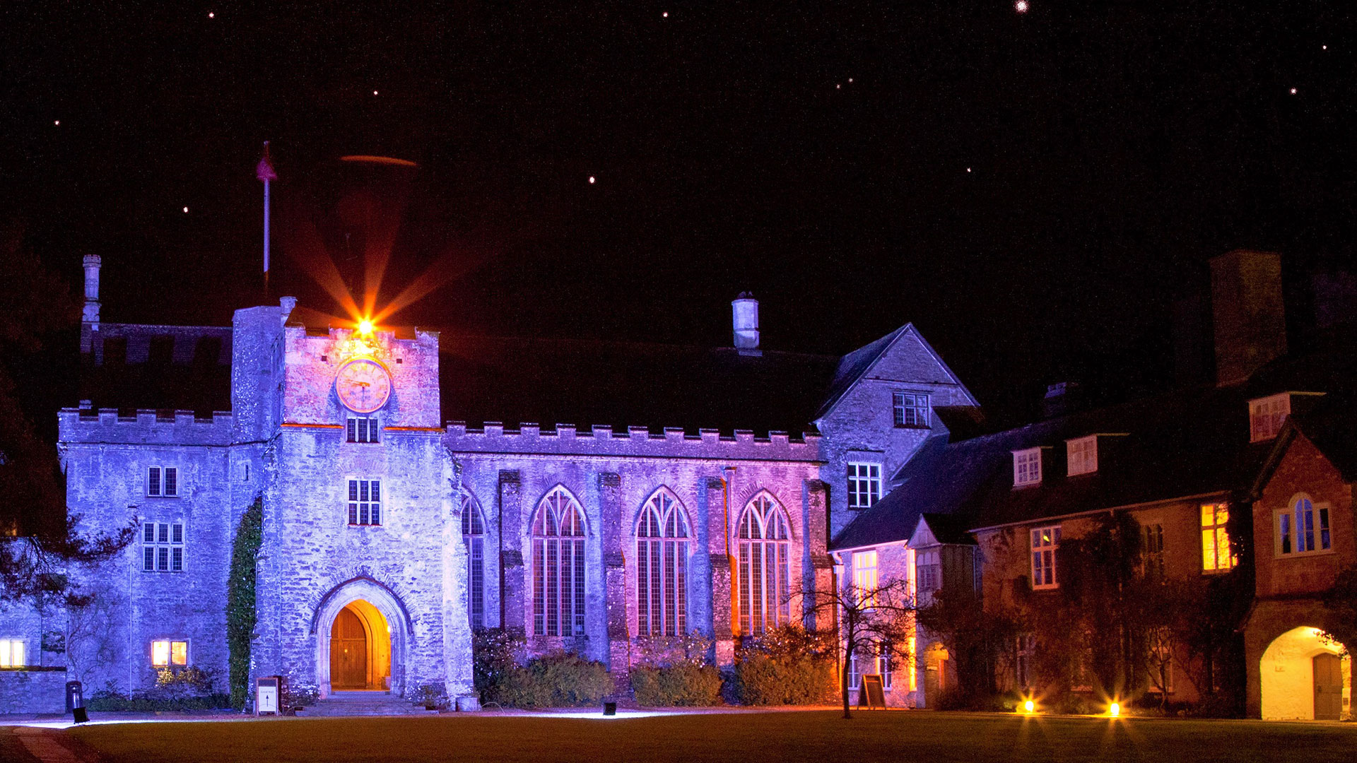 Medieval clock tower at night - Dartington Hall Hotel, South Devon
