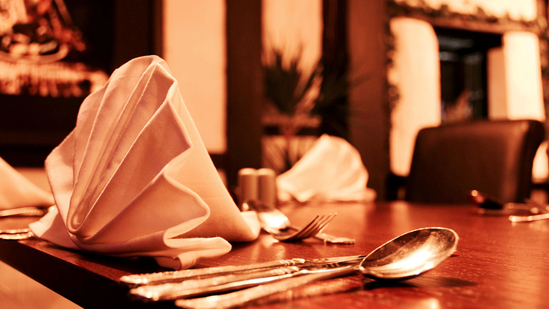 Table set for dinner in the Osteria Chartwell Restaurant - Donnington Manor Hotel, Sevenoaks