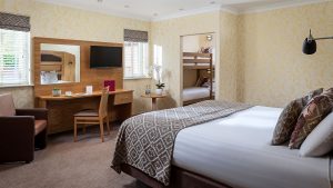 Family room with a double bed and bunk beds - Fairlawns Hotel & Spa, Walsall