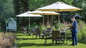 Afternoon tea served on the lawn - Frensham Pond Country House Hotel & Spa, Farnham