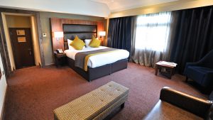 The bedroom in the Honeymoon Suite - Frensham Pond Country House Hotel & Spa, Farnham
