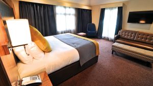 The bedroom in the Honeymoon Suite - Frensham Pond Country House Hotel & Spa, Farnham