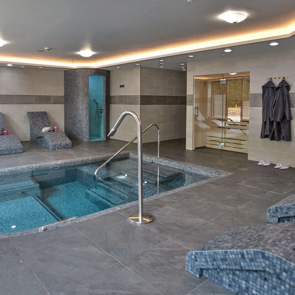 Vitality and wellness pool surrounded by heated loungers - Frensham Pond Country House Hotel & Spa, Farnham