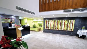 Welcome drink and modern art in reception - Frensham Pond Country House Hotel & Spa, Farnham