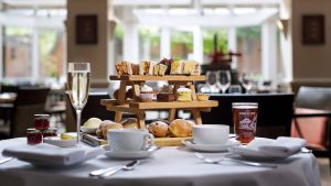 Gentleman's afternoon tea with glass of Champagne and a pint of craft beer in the Winepress Restaurant - Donnington Valley Hotel, Golf & Spa, Newbury