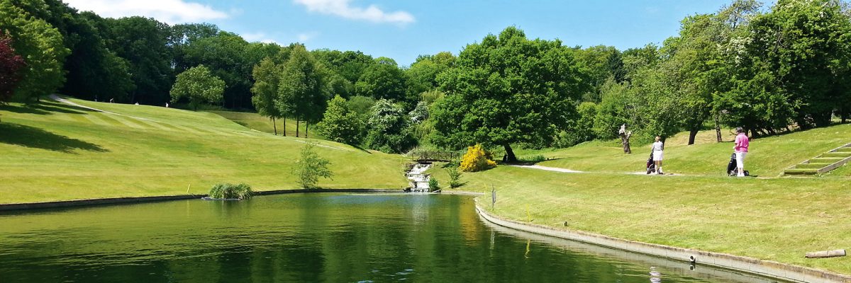Golfers strolling past the lake on their way to play 18 holes - Donnington Valley Hotel, Golf & Spa, Newbury