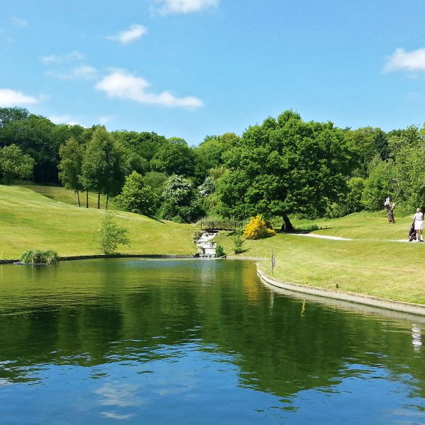 Golfers strolling past the lake on their way to play 18 holes - Donnington Valley Hotel, Golf & Spa, Newbury
