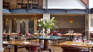 The Winepress restaurant set for dinner - Donnington Valley Hotel, Golf & Spa, Newbury