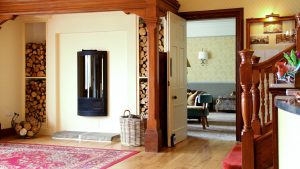 The wood burning fire in the entrance hall - Ilsington Country House Hotel & Spa, Dartmoor