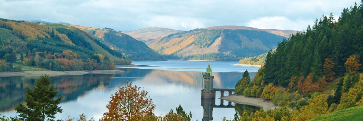 The view of the straining tower on the lake in the Autumn foliage - Lake Vyrnwy Hotel & Spa, Snowdonia