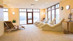 Heated loungers and a view over the lake - Lake Vyrnwy Hotel & Spa, Snowdonia