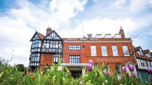 Hotel exterior with the spring tulips - Maids Head hotel, Norwich