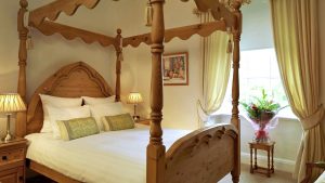 Four poster bed in a Deluxe Double Room - The Morritt Hotel & Garage Spa, Co. Durham