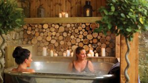 Two ladies enjoying the Garage Spa hot tub - The Morritt Hotel & Garage Spa, Co. Durham