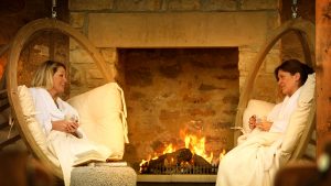 Hanging chairs and a roaring fire in the relaxation room in the Garage Spa - The Morritt Hotel & Garage Spa, Co. Durham