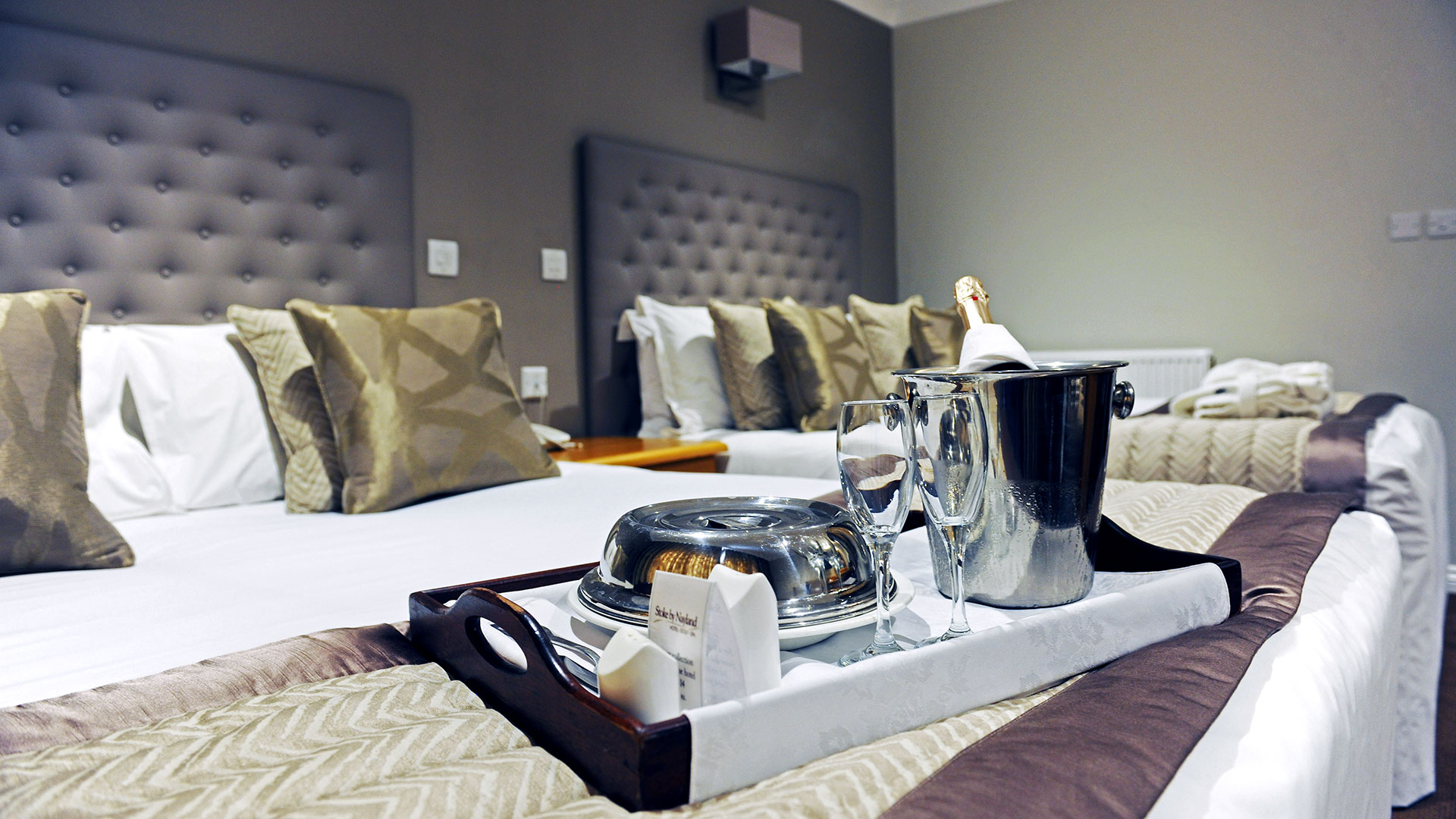 Bottle of Champagne and room service in a Deluxe twin room - Stoke by Nayland Hotel, Golf & Spa