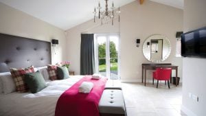 The bedroom of a Luxury Country Lodge - Stoke by Nayland Hotel, Golf & Spa