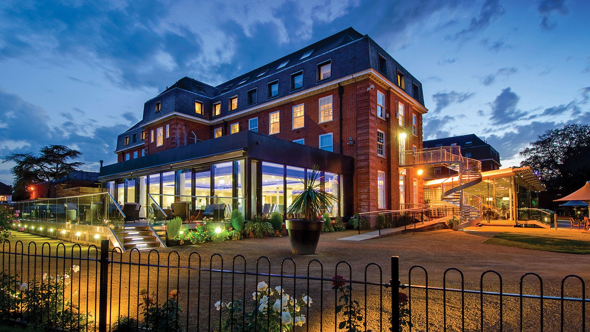 The exterior of the hotel, lit up in the evening - The Lensbury, Teddington