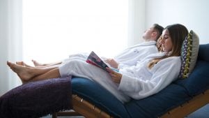A couple in the relaxation room, re-charging on loungers - The Lensbury, Teddington