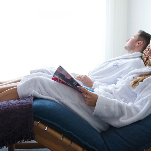 A couple in the relaxation room, re-charging on loungers - The Lensbury, Teddington