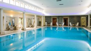 Indoor pool with seating - Tre-Ysgawen Hall Hotel & Spa, Isle of Anglesey