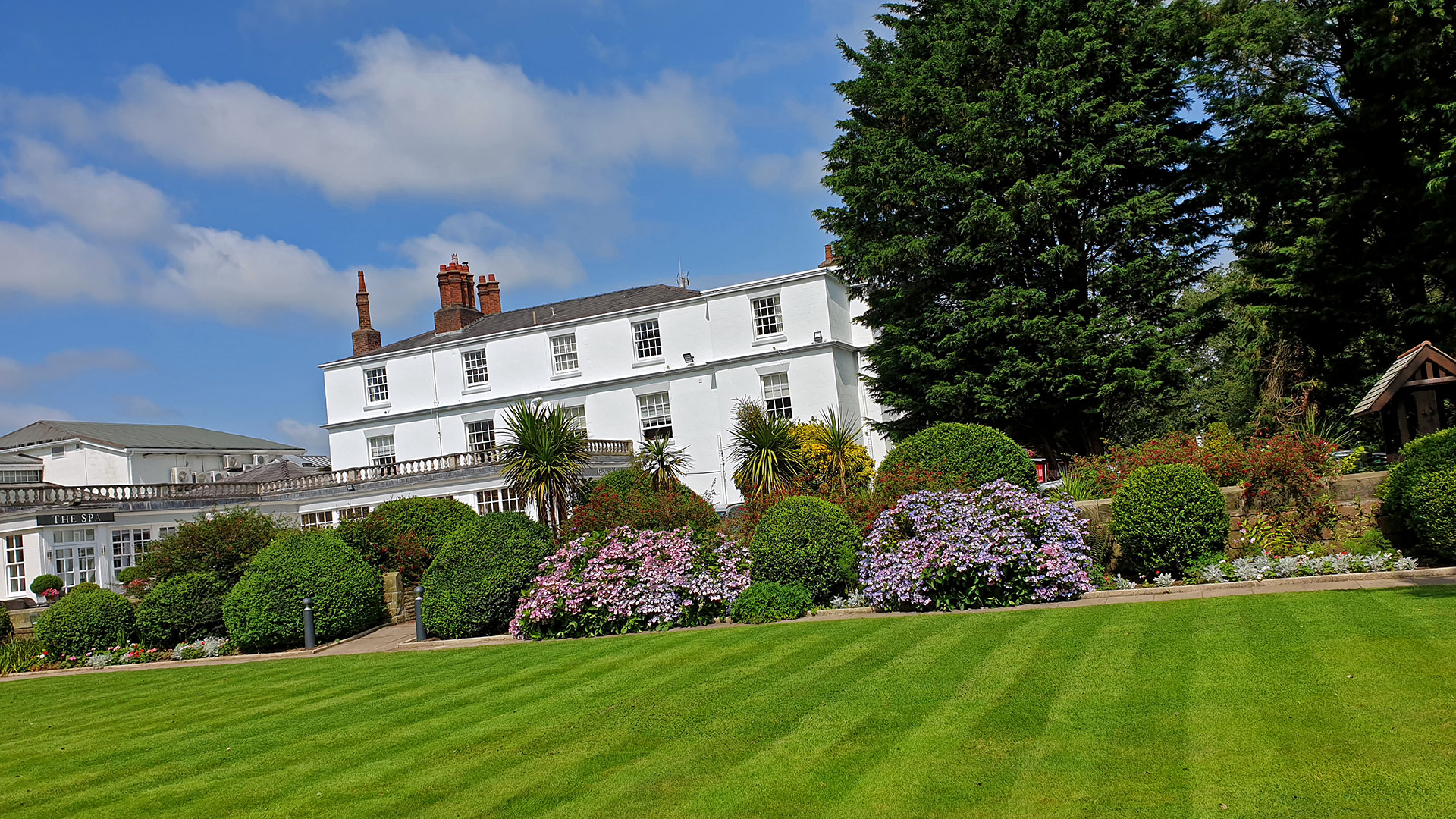 Hotel exterior overlooking the lawn - Rowton Hall Hotel, Chester