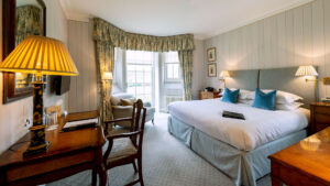 Deluxe double room at The Jockey Club, Newmarket, with a cozy and inviting atmosphere