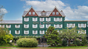 Distinctive green hotel exterior in the sunlight - Metropole Hotel & Spa, Llandrindod Wells