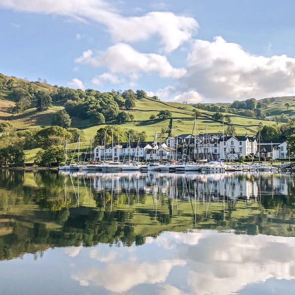 The hotel on the edge of the lake with rolling hills behind it - Low Wood Bay Resort, Lake Windermere