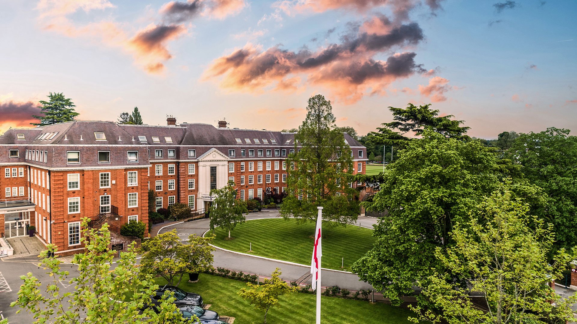 Hotel exterior overlooking the driveway at sunset - The Lensbury, Teddington