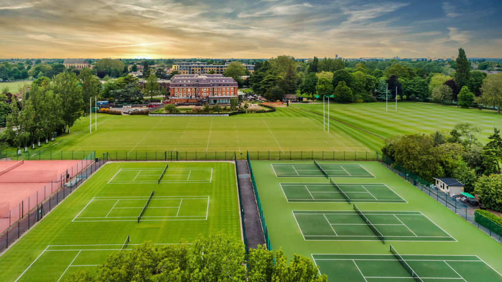 Aerial view of the hotel, rugby pitch and tennis courts - The Lensbury, Teddington