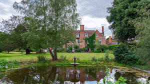 Hotel exterior overlooking the lawn and pond - Hintlesham Hall Hotel, Suffolk