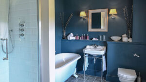 Modern and stylish bathroom in the deluxe double room at The Jockey Club, Newmarket.