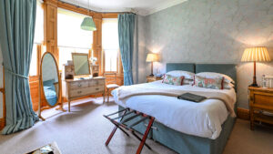 Deluxe double room at The Jockey Club, Newmarket, featuring elegant decor