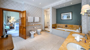 Deluxe double room bathroom at The Jockey Club, Newmarket, featuring modern fixtures