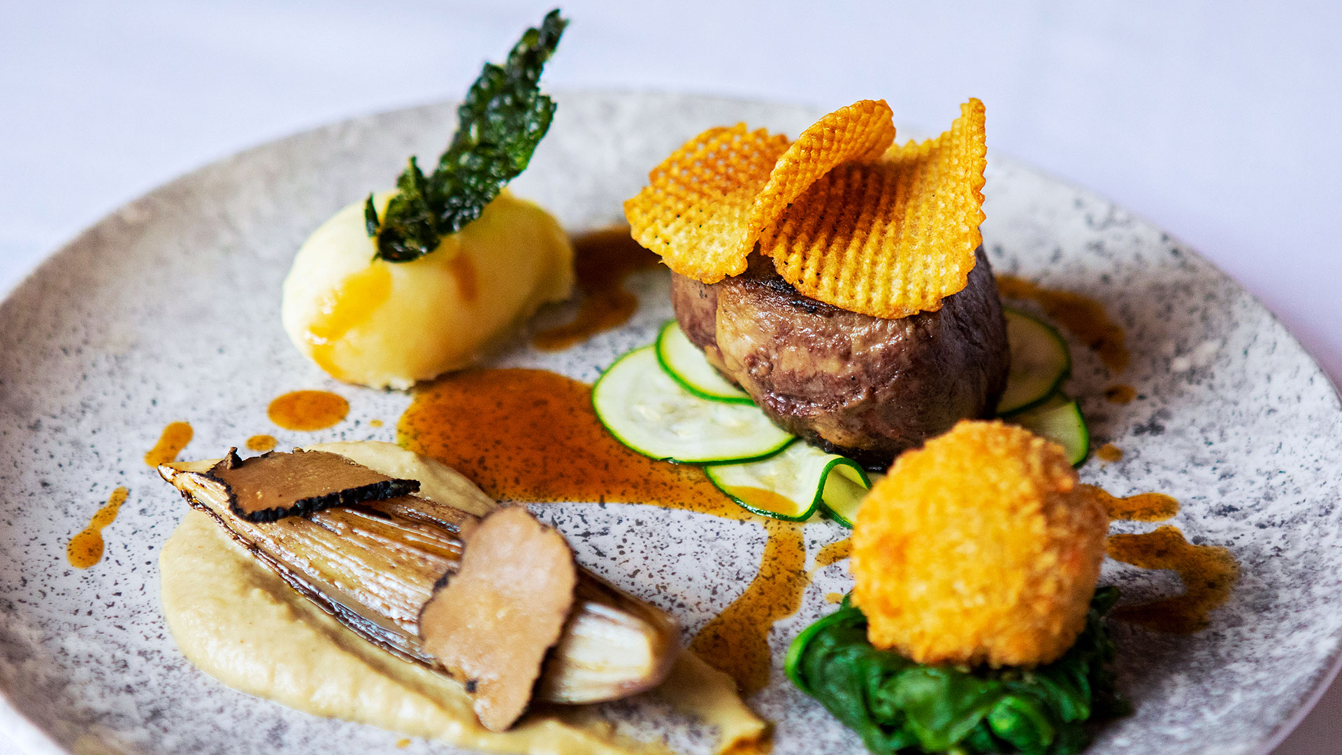 Dining at Hintlesham Hall Hotel in Suffolk, offering a sophisticated culinary experience in an elegant setting - Classic British Hotels